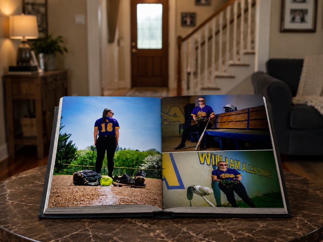 Open custom senior portrait album displayed on a table
