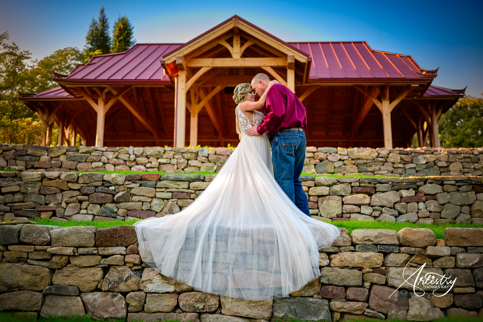 Wedding couple portrait in front of a pavilion
